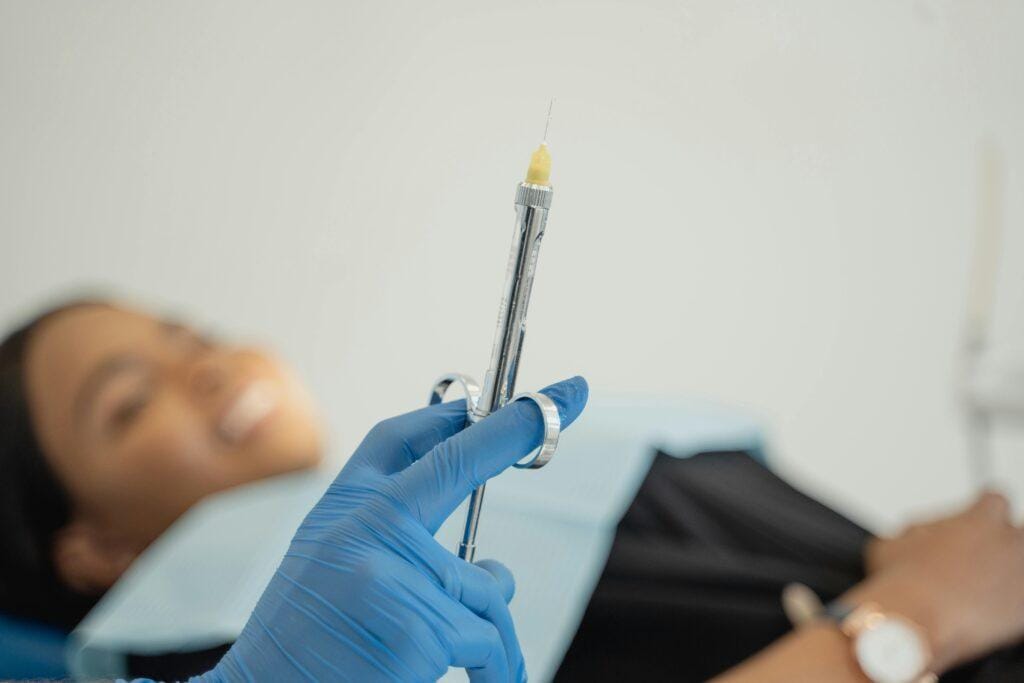 regional-nerve-blockade a doctor holding a syringe of lidocaine 2% for regional nerve blockade.